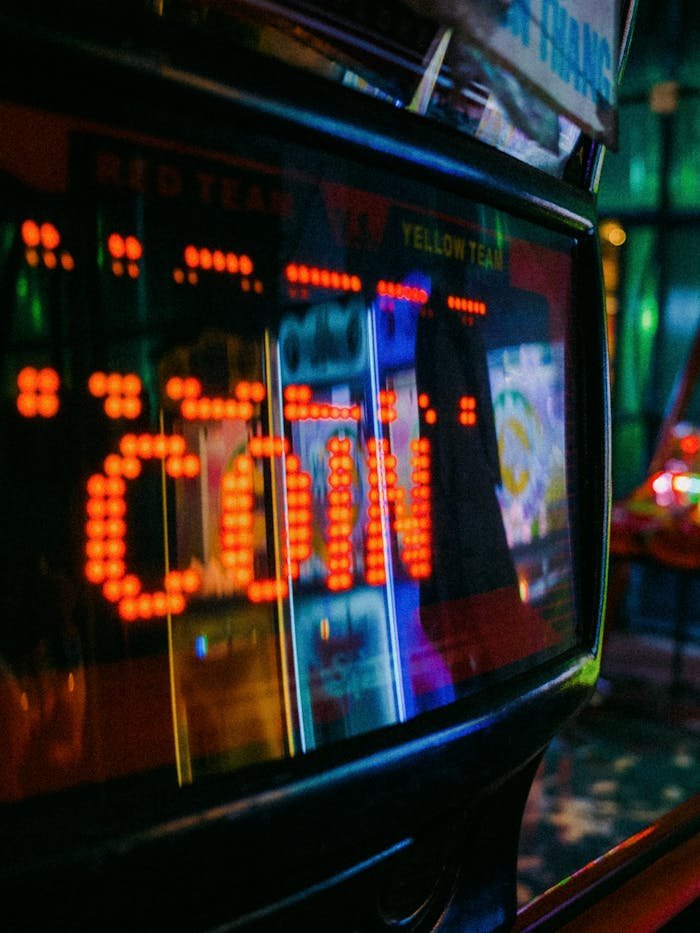 Close-up of a colorful arcade machine display reflecting in Ho Chi Minh City.